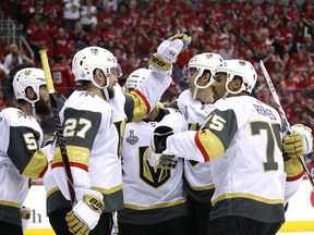 Tomas Nosek (92) of the Vegas Golden Knights is congratulated by his teammates after scoring a third-period goal against the Washington Capitals in Game Three of the 2018 NHL Stanley Cup Final at Capital One Arena on June 2, 2018, in Washington, D.C.