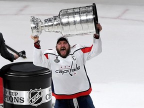 Alex Ovechkin (#8) of the Washington Capitals hoists the Stanley Cup after his team defeated the Vegas Golden Knights 4-3 in Game Five of the 2018 NHL Stanley Cup Final at T-Mobile Arena on June 7, 2018 in Las Vegas, Nevada.