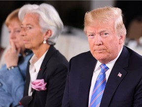 QUEBEC CITY, QC - JUNE 09: (L-R) German Chancellor Angela Merkel, Christine Lagarde and US President Donald Trump during the Gender Equality Advisory Council working breakfast on the second day of the G7 Summit on June 9, 2018 in Quebec City, Canada. Canada are hosting the leaders of the UK, Italy, the US, France, Germany and Japan for the two day summit, in the town of La Malbaie.