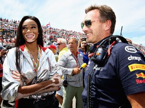 Red Bull Racing team principal Christian Horner talks with supermodel Winnie Harlow on the grid before the Canadian Formula One Grand Prix at Circuit Gilles Villeneuve on June 10, 2018.