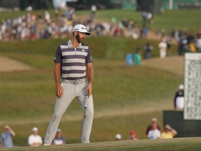 Dustin Johnson reacts to a missed birdie putt on the 17th green during the third round of the U.S. Open on Saturday at Shinnecock Hills Golf Club in Southampton, N.Y.