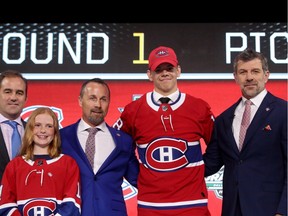 Jesperi Kotkaniemi poses with Canadiens owner Geoff Molson, assistant general manager Trevor Timmins and GM Marc Bergevin after being selected third overall by the Montreal Canadiens on Friday night.