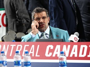 Canadiens general manager Marc Bergevin talks on the phone during 2018 NHL Draft on June 23, 2018 at the American Airlines Center in Dallas.