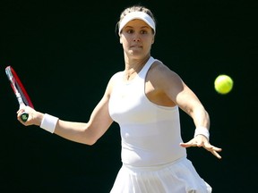 Montreal's Eugenie Bouchard returns a shot during her singles qualifying win over Karolina Muchova of the Czech Republic on June 27, 2018, in London.