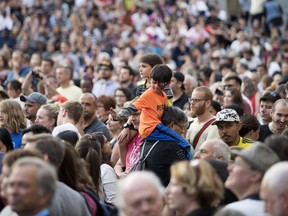 A crowd fills in Sainte-Catherine Street to listen to Banda Magda during the opening day of the Montreal International Jazz Festival in Montreal on Thursday June 28, 2018.