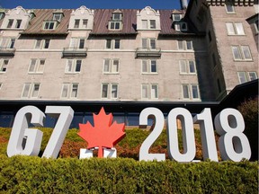 A sign sits in front of the Manoir Richelieu, the site of the G7 leaders' summit in La Malbaie, Que., June 8, 2018.