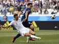 Poland's forward Robert Lewandowski (L) vies with Japan's defender Maya Yoshida during the Russia 2018 World Cup Group H football match between Japan and Poland at the Volgograd Arena in Volgograd on June 28, 2018. (PHILIPPE DESMAZES/AFP/Getty Images)