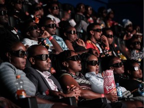 Invited guests watch Black Panther in 3D in this February file photo. Scanline VFX's Montreal studio will be headed by Geoffrey Baumann, who supervised all visual effects on the film.