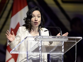 Bloc Québécois Leader Martine Ouellet jokes during her speech at the Parliamentary Press Gallery Dinner at the Museum of History in Gatineau on Saturday, May 26, 2018. Ouellet is facing more stiff opposition as Bloc members get ready to vote on her leadership.