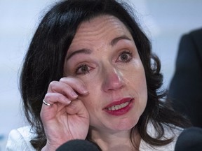 Martine Ouellet wipes a tear during a press conference in Montreal June 4, 2018. Ouellet announced she is stepping down as head of the Bloc Quebecois after a resounding defeat in a weekend leadership vote.