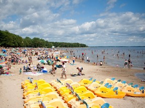 Beach-goers enjoy the sun and water at the Oka National park on Wednesday, July 27, 2011 in Oka, Quebec.