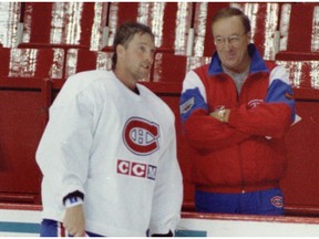 Head coach Jacques Demers seemed pleased to have Patrick Roy on the ice for the first day of the Montreal Canadiens' training camp at the Forum on Sept. 12, 1995.