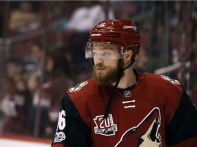 Max Domi gets ready for the start of NHL game between his Arizona Coyotes and the Carolina Hurricanes in Glendale, Ariz.