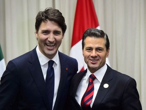 Prime Minister Justin Trudeau meets with Mexican President Enrique Pena Nieto in Lima, Peru on Friday, April 13, 2018. Mexico and Canada renewed their commitment to the bare knuckled NAFTA renegotiation after absorbing the blow of the Trump administration's decision to impose potentially debilitating new tariffs on steel and aluminum imports.