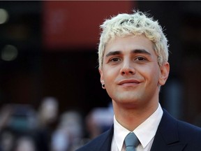 Actor and director Xavier Dolan poses for photos on the red carpet of the 12th edition of the Rome Film Festival, in Rome, on Oct. 27, 2017.