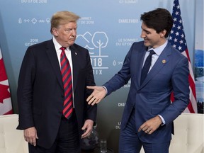 Canadian Prime Minister Justin Trudeau shakes hands with U.S. President Donald Trump during a meeting at the G7 leaders summit in La Malbaie, Que., June 8, 2018.