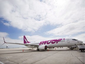 A Swoop Airlines Boeing 737 is on display during their media event on Tuesday, June 19, 2018, at John C. Munro International Airport in Hamilton, Ont.