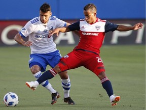 FC Dallas midfielder Michael Barrios (21) vies for the ball with Montreal Impact midfielder Saphir Taider during the first half of an MLS soccer match Saturday, June 9, 2018, in Frisco, Texas.