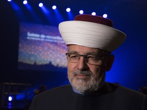 Imam Hassan Guillet arrives at a gathering at the Pavillon de la Jeunesse, marking the first anniversary of the mosque shooting, Sunday, Jan. 28, 2018 in Quebec City.