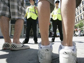 In Montreal, police cadets keep an eye on pedestrians to keep them from jaywalking.