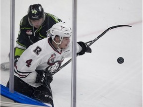 Red Deer Rebels' Alexander Alexeyev, No. 4, and Edmonton Oil Kings' Andrei Pavlenko pursue the puck during WHL action on September 24, 2017, in Edmonton. Alexeyev had seven goals and 37 points in 45 games with the Red Deer Rebels last season.