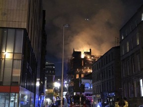 Flames rise from the Glasgow School of Art's Mackintosh Building in London, early Saturday, June 16, 2018. A large blaze ripped through the building at the Glasgow School of Art late Friday, the second time in four years that fire has damaged the famed Scottish school.