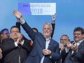 Quebec Premier Philippe Couillard waves to delagates following his speech at a Qubec party general council meeting in Montreal on Saturday, June 2, 2018.