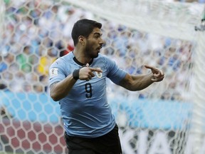 Uruguay's Luis Suarez celebrates scoring his side's first goal during the group A match against Saudi Arabia at the 2018 soccer World Cup in Rostov Arena in Rostov-on-Don, Russia, Wednesday, June 20, 2018.