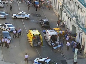 In this image provided by Moscow Traffic Control Center Press Service, ambulance and police work at the site of an incident after a taxi crashed into pedestrians on a sidewalk near Red Square in Moscow, Russia, Saturday, June 16, 2018. Police in Moscow say at least seven people have been injured when a taxi crashed into pedestrians on a sidewalk near Red Square. (Moscow Traffic Control Center Press Service via AP) ORG XMIT: XAZ146