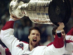Patrick Roy holds the Stanley Cup aloft after the Montreal Canadiens beat Wayne Gretzky and the Los Angeles Kings in five games in 1993. The Canadiens won an unprecedented 10 consecutive overtime games en route to their improbable Stanley Cup win 25 years ago.