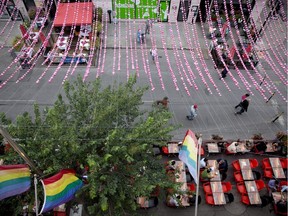 After initially announcing they will come down, the city says a new installation of the rainbow-coloured balls draped over Ste-Catherine St. is coming to the Gay Village next year.