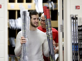 Centre Phillip Danault packs some of his sticks in the Canadiens' locker room at the Bell Sports Complex in Brossard on April 9, 2018, after after the team failed to qualify for the NHL playoffs.