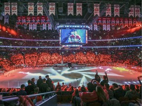 Montreal Canadiens fans watch light show prior to the start of Game 1 of the first round of the NHL playoffs against the New York Rangers in Montreal on April 12, 2017.