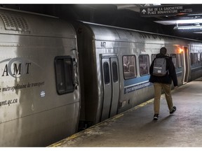 Commuters board the trains on Deux-Montagnes line at Central Station in Montreal, on Wednesday, April 25, 2018.