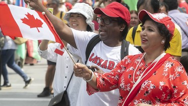 People enjoy the festivities surrounding the Canada Day parade in downtown Montreal on Sunday July 1, 2018. (Pierre Obendrauf / MONTREAL GAZETTE)