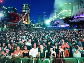 Fans fill Place des Festivals to watch Jessie Reyez perform at a free outdoor show at the Montreal International Jazz Festival on July 3, 2018.