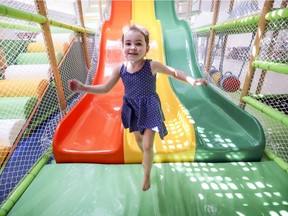 Four-year-old Lexie hops off the slide in the Pincourt Indoor Municipal Park in Pincourt.