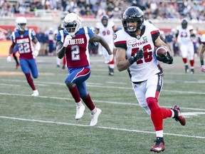 Redblacks' Jean-Christophe Beaulieu gets behind Alouettes' Dominique Ellis, 2, on his way to a touchdown during first half Friday night at Molson stadium.
