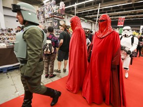 People dressed as Star Wars characters march through the exhibition hall at Montreal Comiccon at the Palais des Congres Friday July 6, 2018. (John Mahoney / MONTREAL GAZETTE)