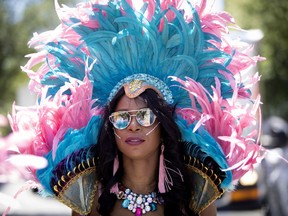 A Dancer takes part in the Carifiesta Parade in Montreal on Saturday July 7, 2018. (Allen McInnis / MONTREAL GAZETTE) ORG XMIT: 61061