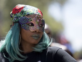 A participant takes in the Carifiesta parade in Montreal July 7, 2018.