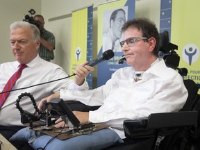 Daniel Pilote, right, speaks about patient conditions in long-term care centres during a press conference in Montreal on Tuesday, July 10, 2018. Paul G. Brunet, executive director of the Conseil pour la protection des malades, holds the microphone.
