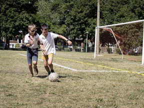 soccer Benoit Lefebvre, right, and his brother Alberic take advantage of an empty field at Parc Trenholme in N.D.G. on Wednesday. A Université de Montréal study will look at how urban design affects social and physical activities.