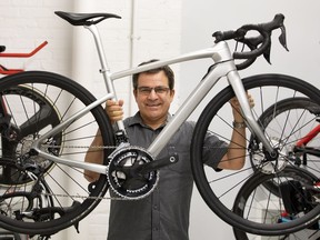 Argon 18 president and co-founder Gervais Rioux holds up the new Argon 18 bike they will co-develop with Mercedes-Benz.