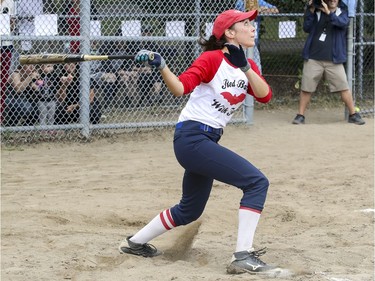 Marisa Berry Mendez watches her fly ball hit during exhibition softball game between local players and Expos Nation at Jeanne Mance Park in Montreal Saturday July 14, 2018.  The event was held in response to the Plateau Mont-Royal's decision to close the north softball field in the same park.  (John Mahoney / MONTREAL GAZETTE) ORG XMIT: 61056 - 0407