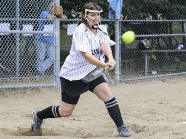 Casey McCormick hits the ball during exhibition softball game between local players and Expos Nation at Jeanne Mance Park in Montreal Saturday July 14, 2018.  The event was held in response to the Plateau Mont-Royal's decision to close the north softball field in the same park.  (John Mahoney / MONTREAL GAZETTE) ORG XMIT: 61056 - 0420