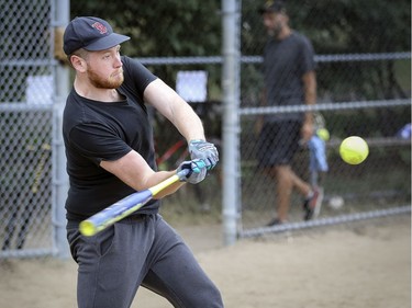 Samson Smith hits a home run during exhibition softball game between local players and Expos Nation at Jeanne Mance Park in Montreal Saturday July 14, 2018.  The event was held in response to the Plateau Mont-Royal's decision to close the north softball field in the same park.  (John Mahoney / MONTREAL GAZETTE) ORG XMIT: 61056 - 0472