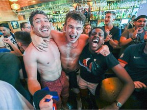 French football fans celebrate in Bar Barouf in Montreal Sunday July 15, 2018 following France's World Cup victory over Croatia. (John Mahoney / MONTREAL GAZETTE)