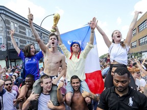 French football fans pack the intersection of St-Denis and Rachel Sts. in Montreal Sunday July 15, 2018 following France's World Cup victory over Croatia.
