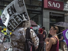 Striking SAQ workers shut down hundreds of liquor stores across Quebec in July 2018.